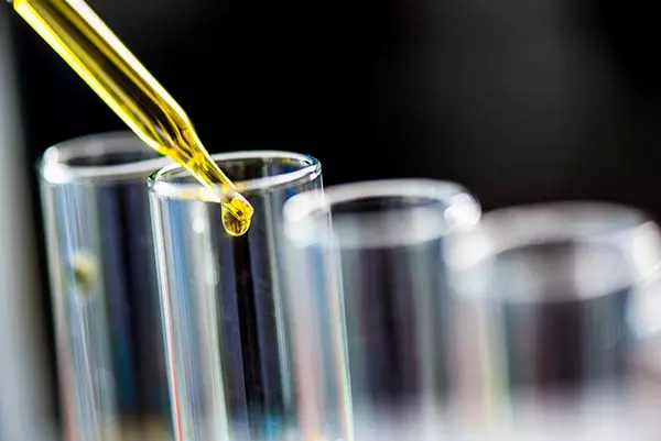 Using dropper sampling oil or chemical liquid drop to test tube